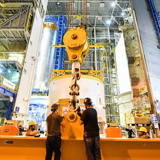 High integrity crane in front of an aerospace aluminum tank.